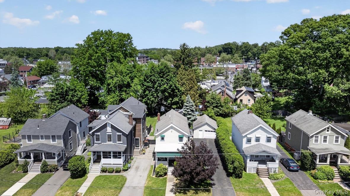 250 Rombout Avenue Beacon, NY 12508 - Photo 29 of 33 an aerial view of a residential apartment building with a yard and parking spaces