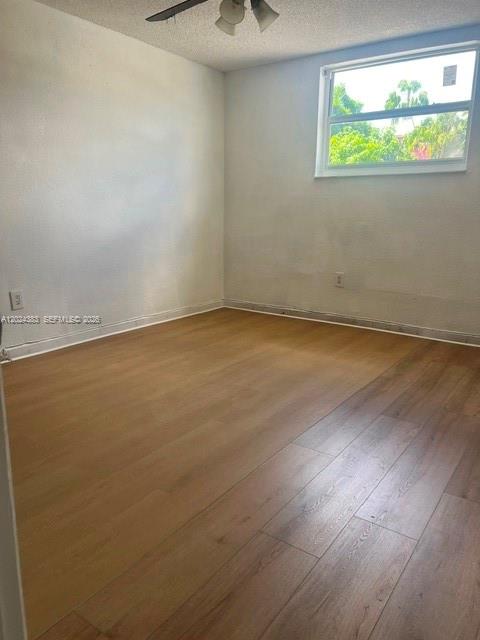 666 West 81st Street, Unit 103 Hialeah, FL 33014 - Photo 5 of 12 an empty room with a window