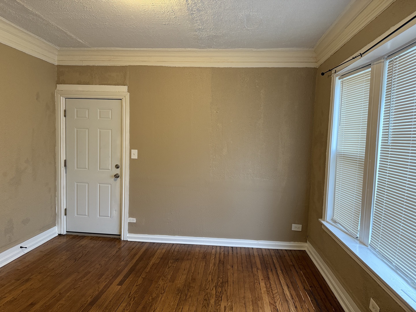 5658 South Honore Street, Unit 1F Chicago, IL 60636 - Photo 2 of 7 a view of a small space with wooden floor and a window