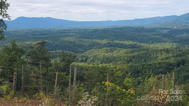 a view of mountains and valleys