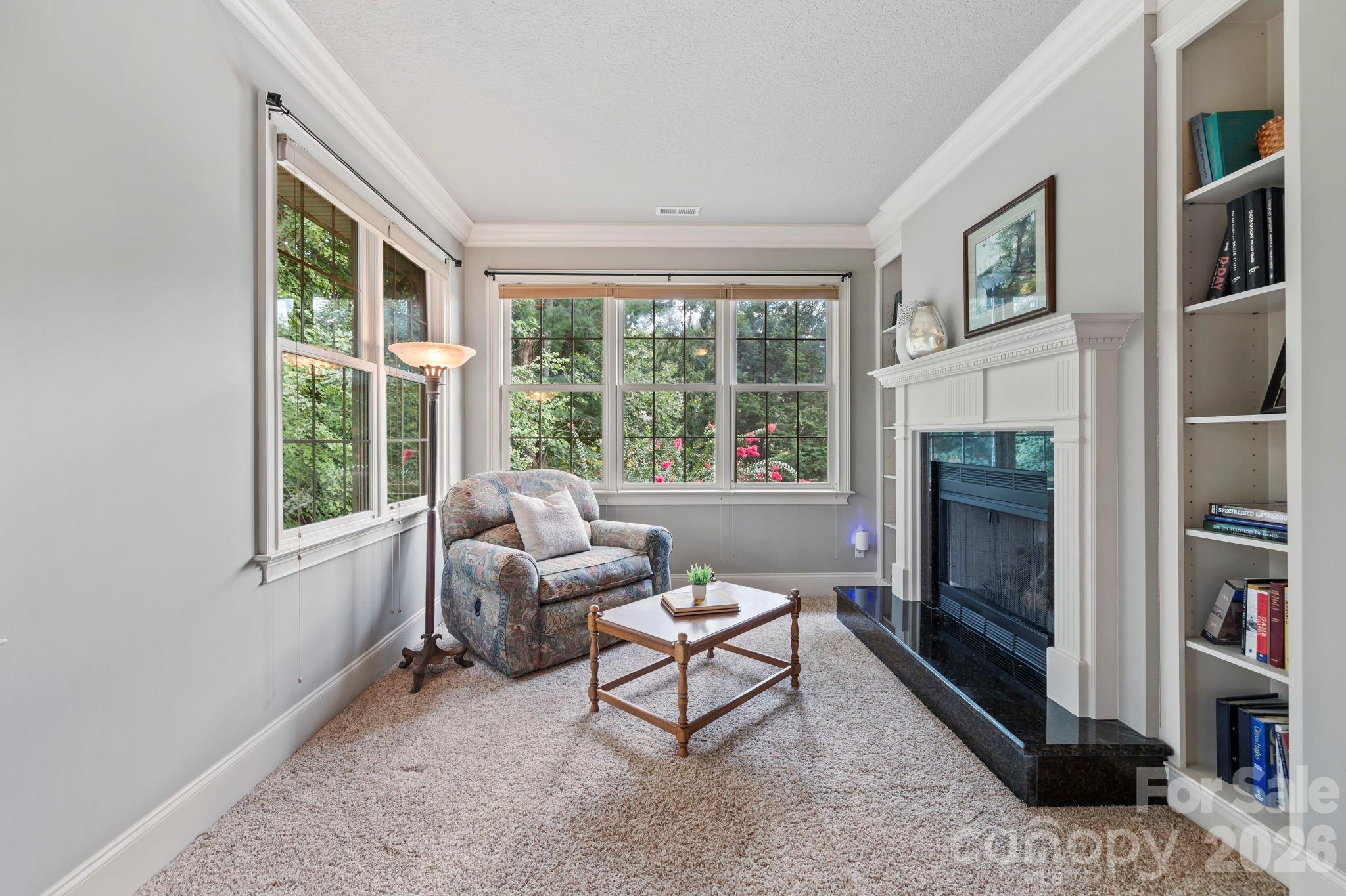 46 Beale Court Fletcher, NC 28732 - Photo 19 of 48 a living room with furniture a window and a fireplace