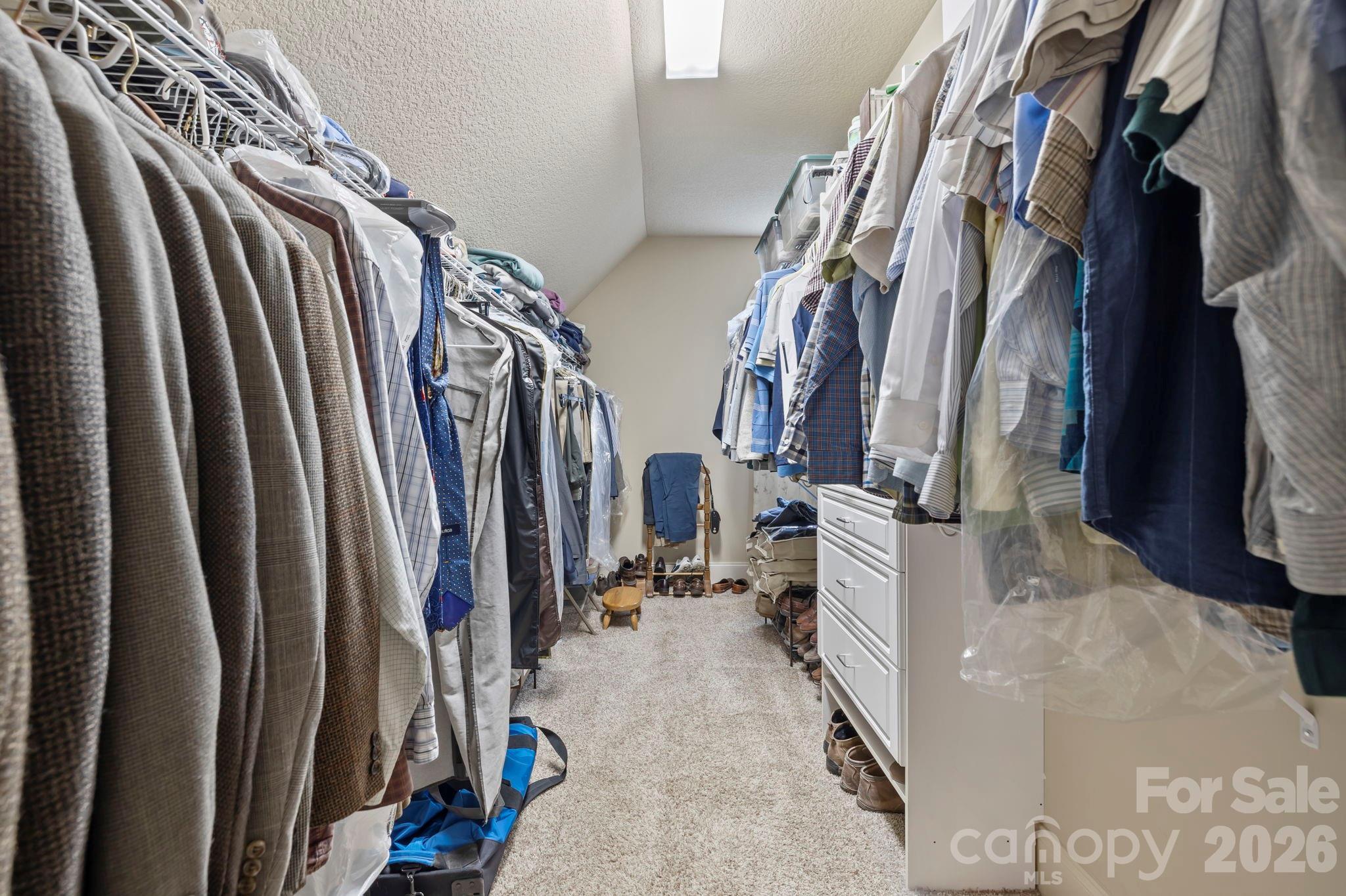 46 Beale Court Fletcher, NC 28732 - Photo 23 of 48 a view of walk in closet with clothes and shoes