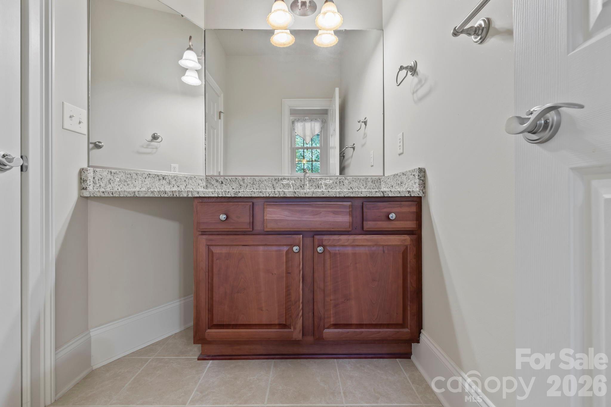 46 Beale Court Fletcher, NC 28732 - Photo 26 of 48 a bathroom with a sink and a mirror