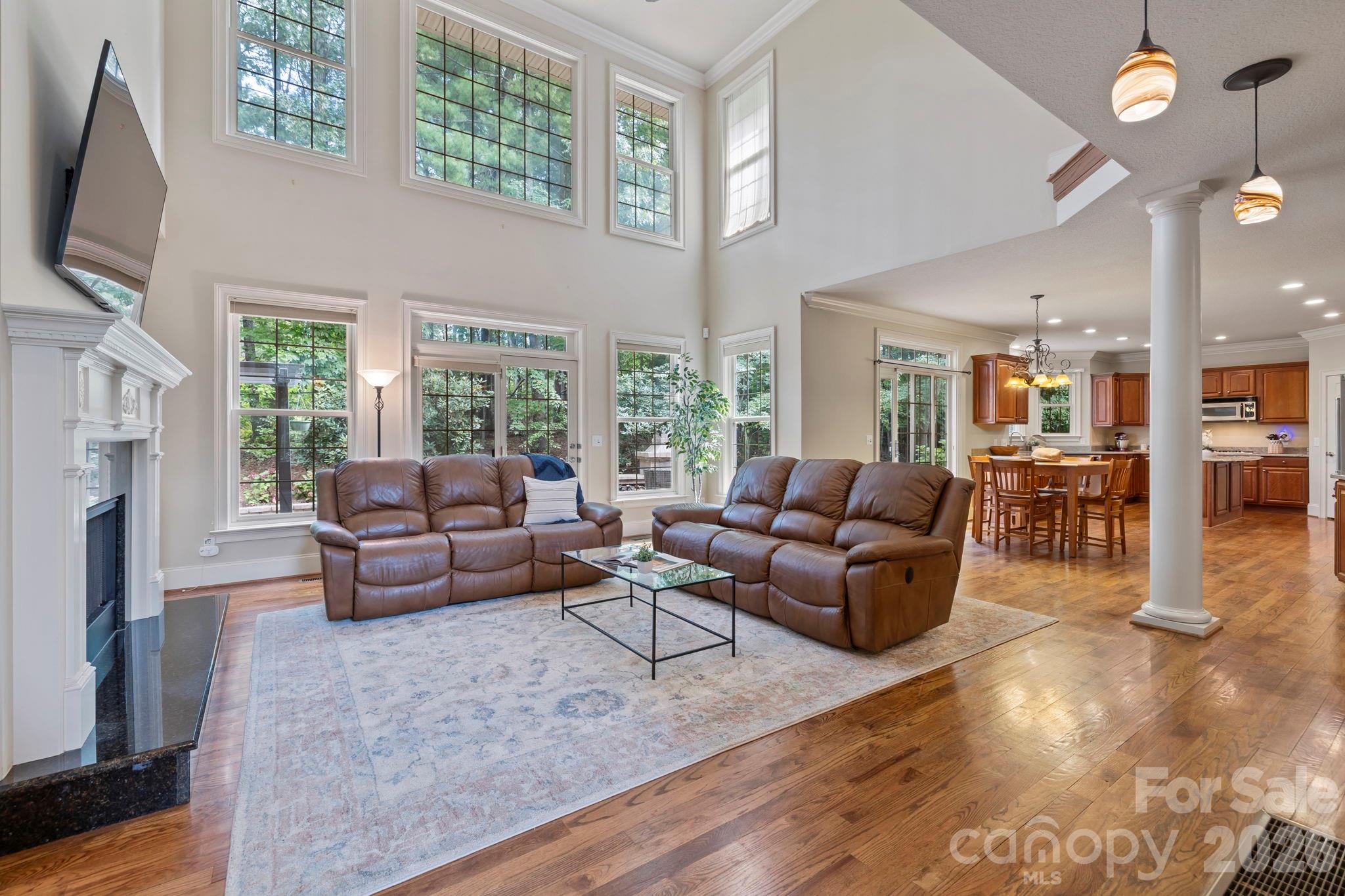 46 Beale Court Fletcher, NC 28732 - Photo 5 of 48 a living room with furniture wooden floor and a flat screen tv