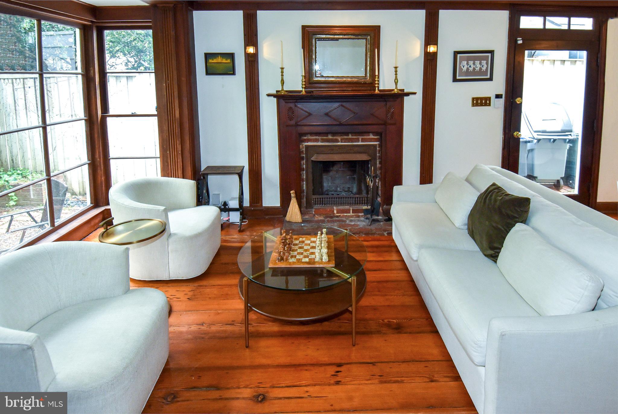 1412 27th Street Northwest Washington, DC 20007 - Photo 11 of 28 a living room with furniture and a fireplace