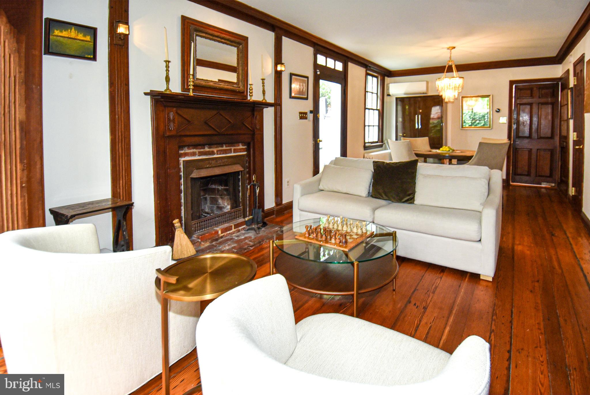 1412 27th Street Northwest Washington, DC 20007 - Photo 13 of 28 a living room with furniture fireplace and a large window