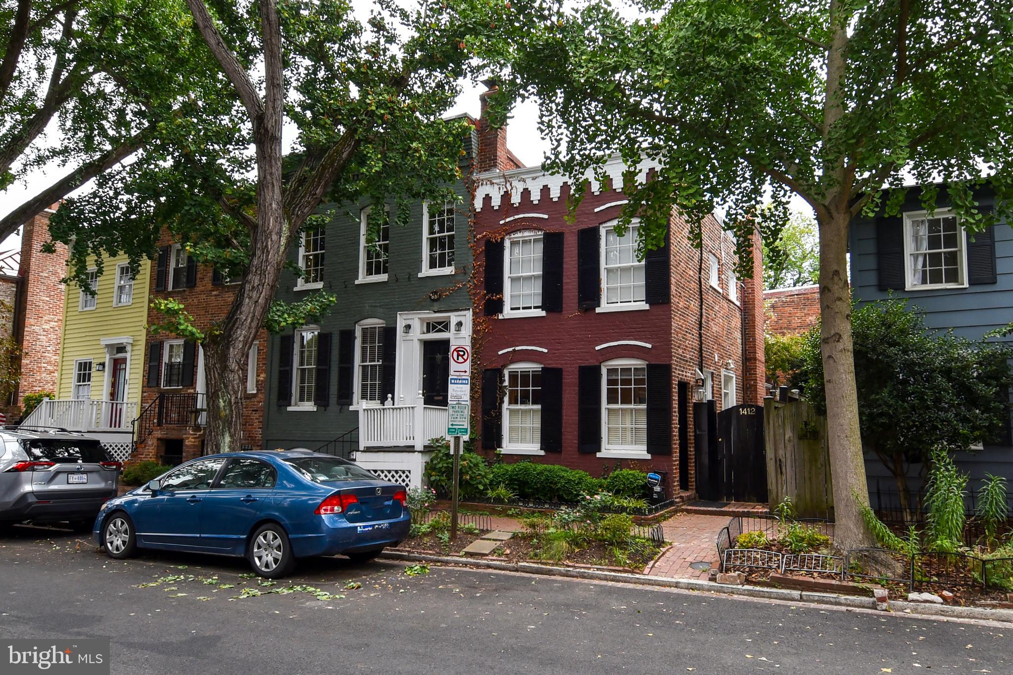 1412 27th Street Northwest Washington, DC 20007 - Photo 2 of 28 front view of a brick house with a yard