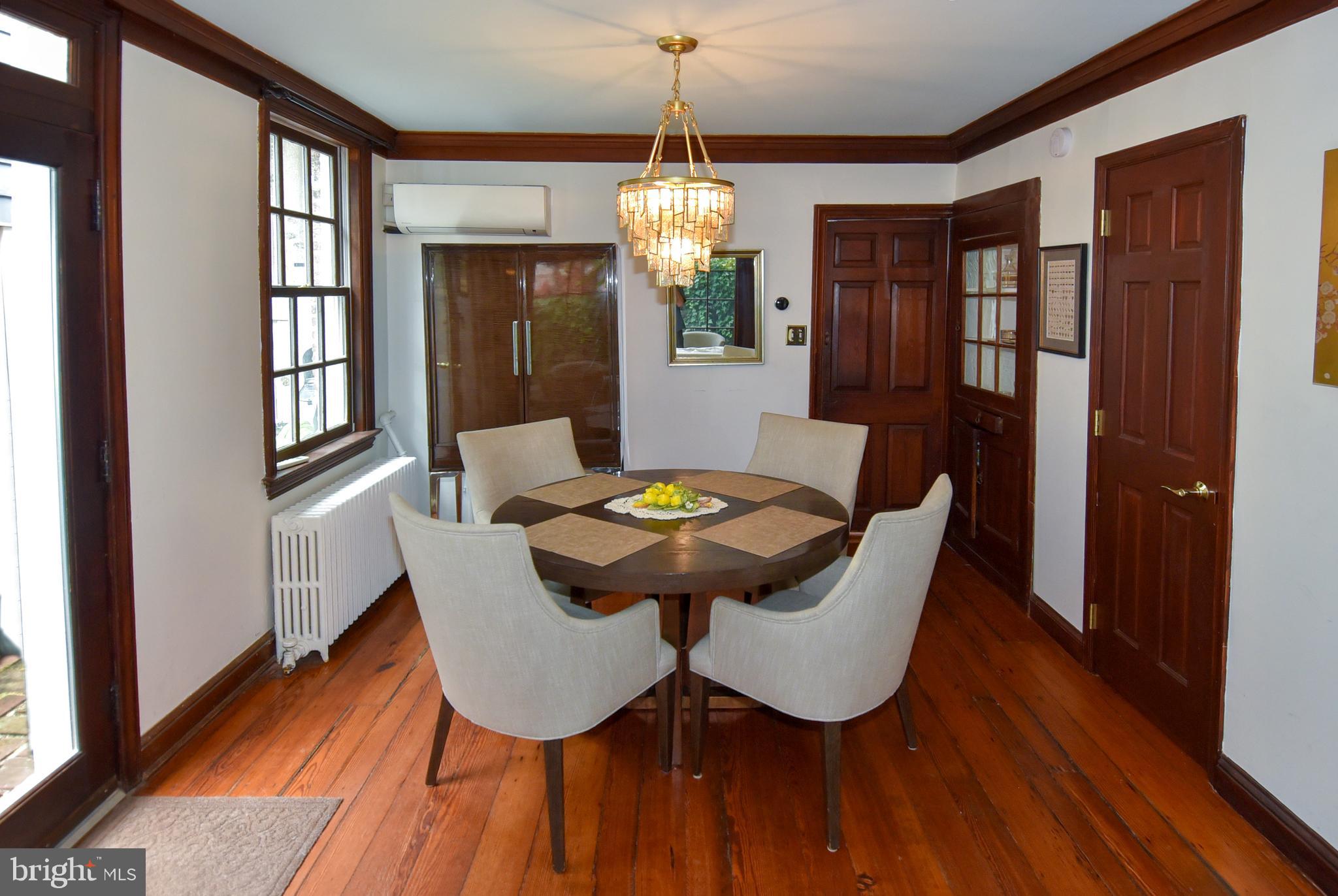 1412 27th Street Northwest Washington, DC 20007 - Photo 5 of 28 a view of a dining room with furniture window and wooden floor