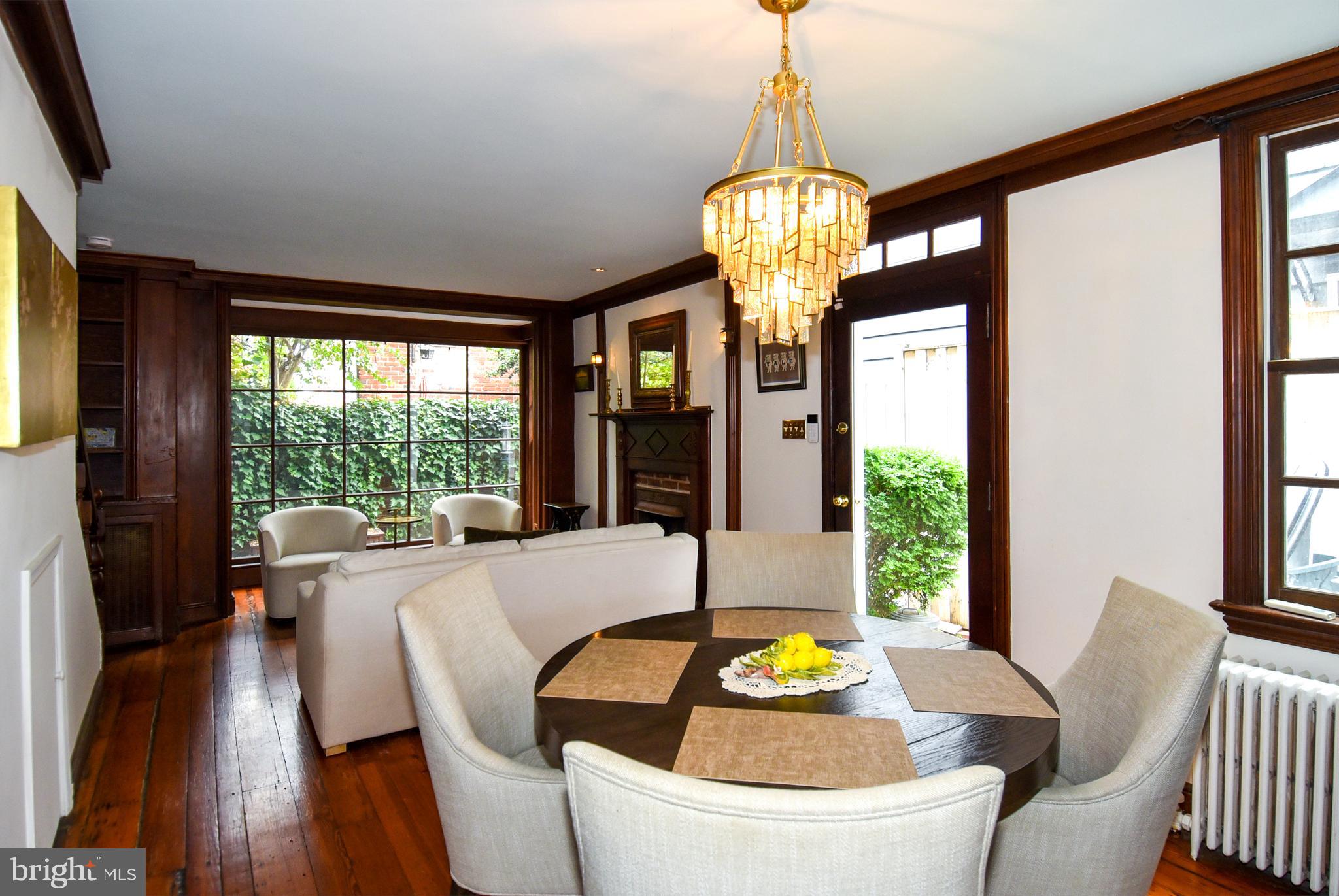 1412 27th Street Northwest Washington, DC 20007 - Photo 6 of 28 a view of a dining room with furniture wooden floor and chandelier