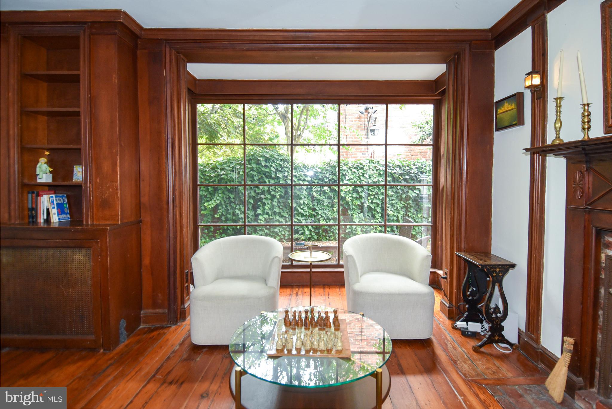 1412 27th Street Northwest Washington, DC 20007 - Photo 7 of 28 a dining room with furniture a window and wooden floor