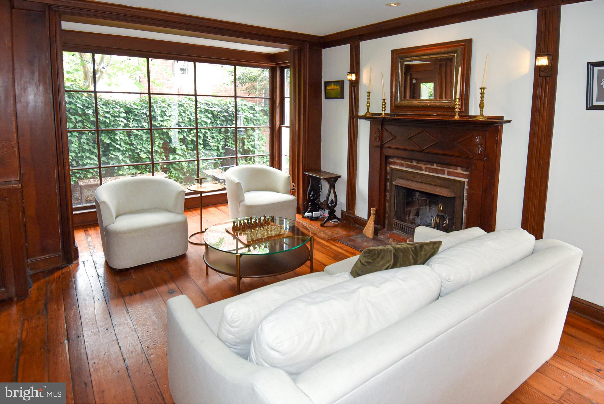 1412 27th Street Northwest Washington, DC 20007 - Photo 9 of 28 a living room with furniture and a fireplace