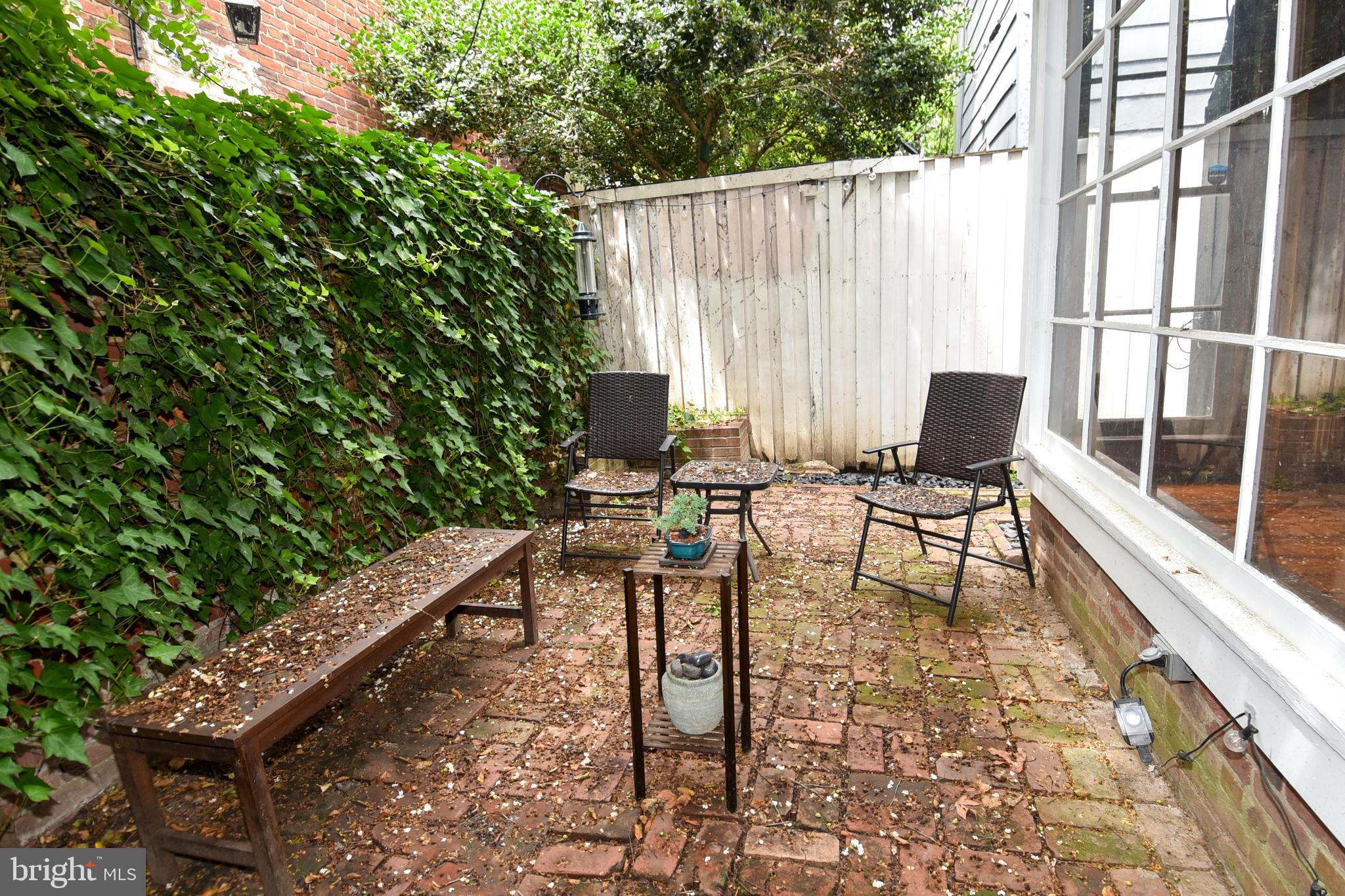 1412 27th Street Northwest Washington, DC 20007 - Photo 10 of 28 a couple of chairs sitting in patio with yard