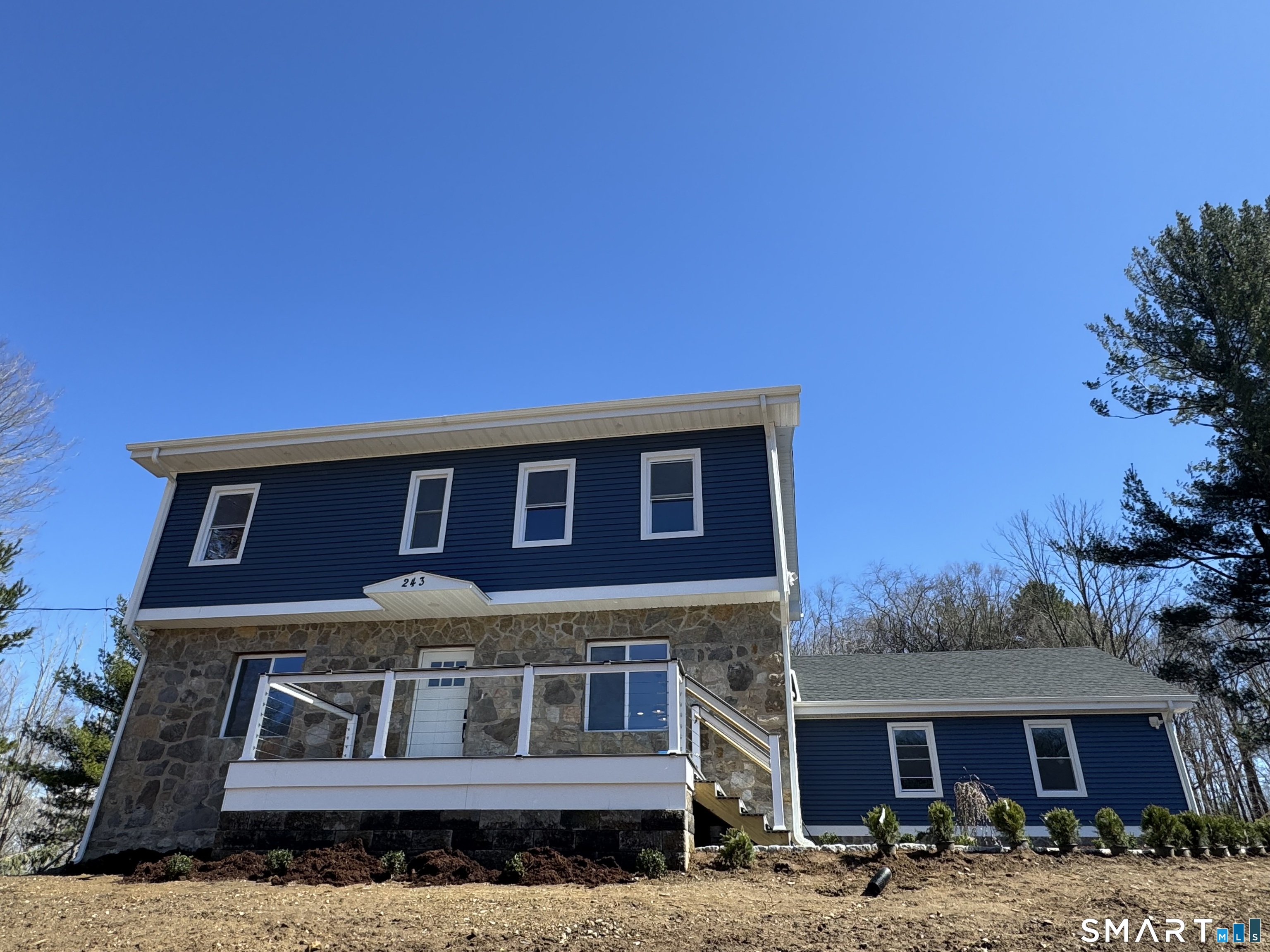 a front view of a house with parking space
