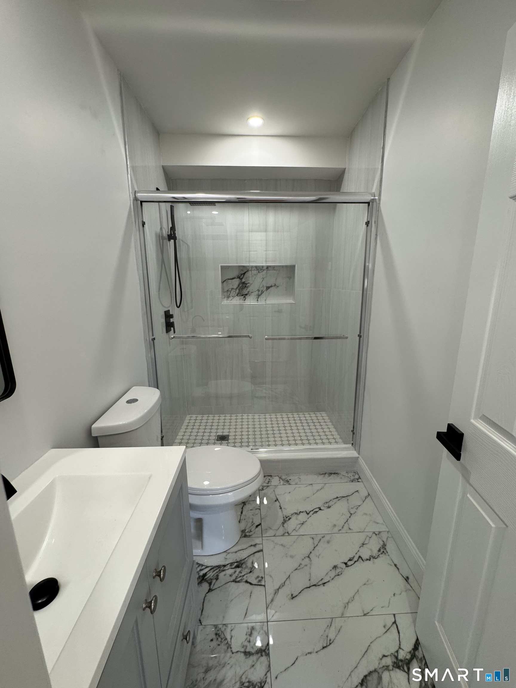 243 Long Hill Road Andover, CT 06232 - Photo 12 of 31 a bathroom with a sink toilet and shower