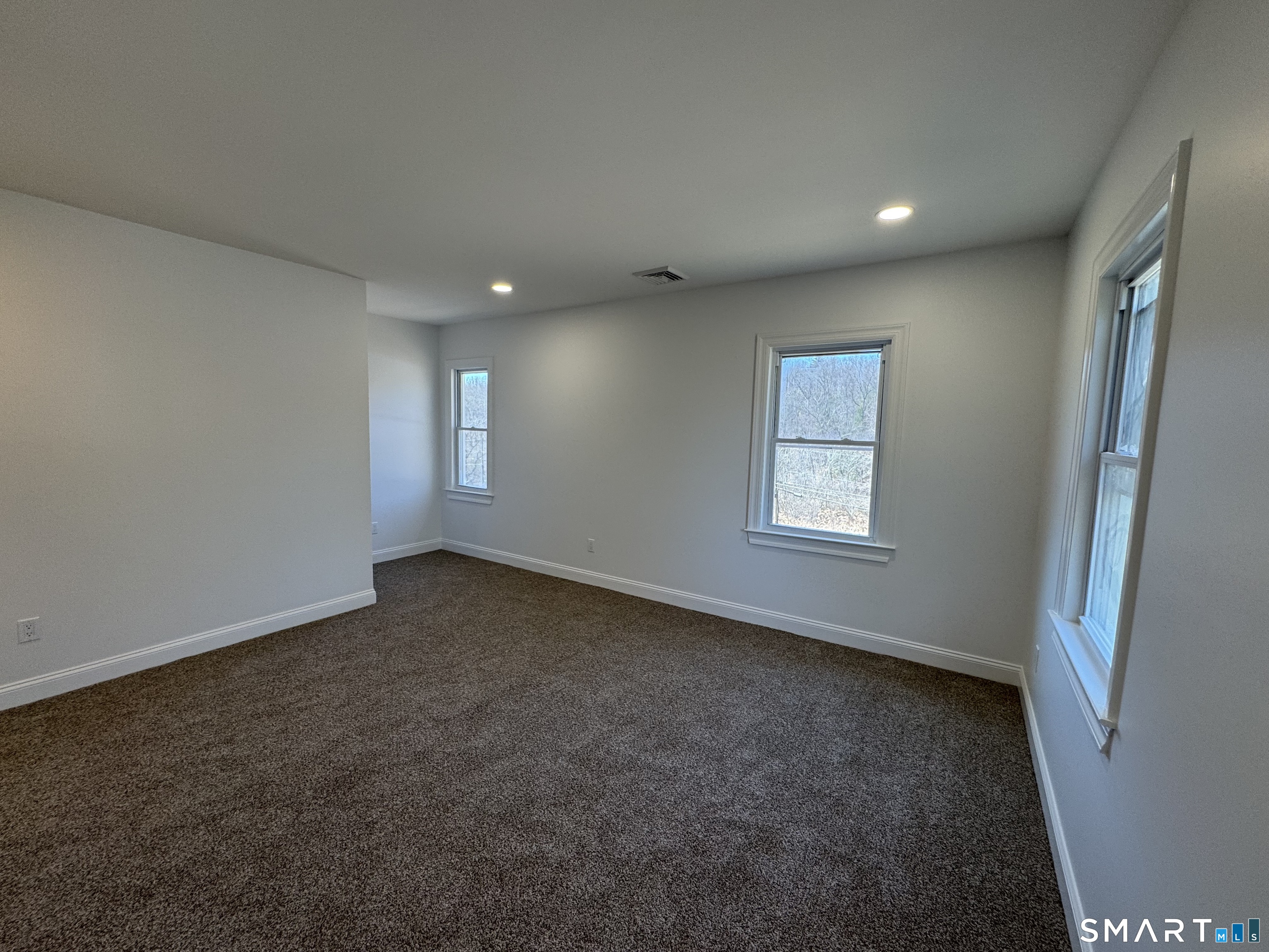 243 Long Hill Road Andover, CT 06232 - Photo 19 of 31 an empty room with windows and closet
