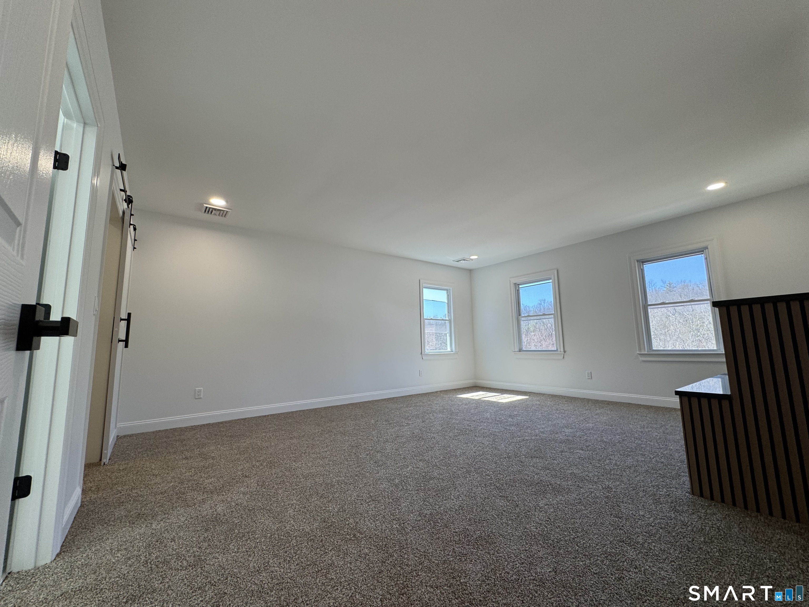 243 Long Hill Road Andover, CT 06232 - Photo 20 of 31 an empty room with windows and closet