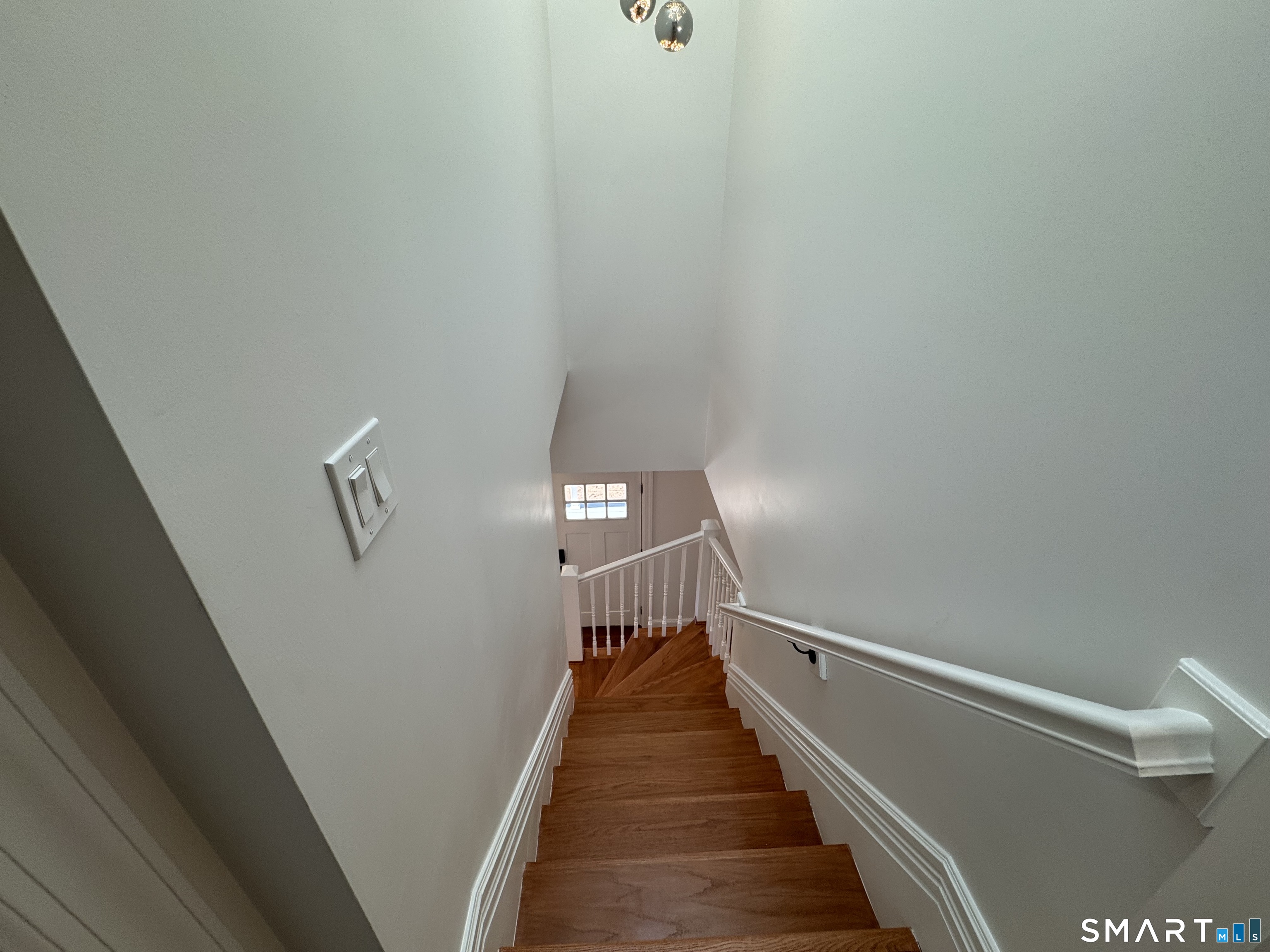 243 Long Hill Road Andover, CT 06232 - Photo 21 of 31 a view of a hallway with wooden floor