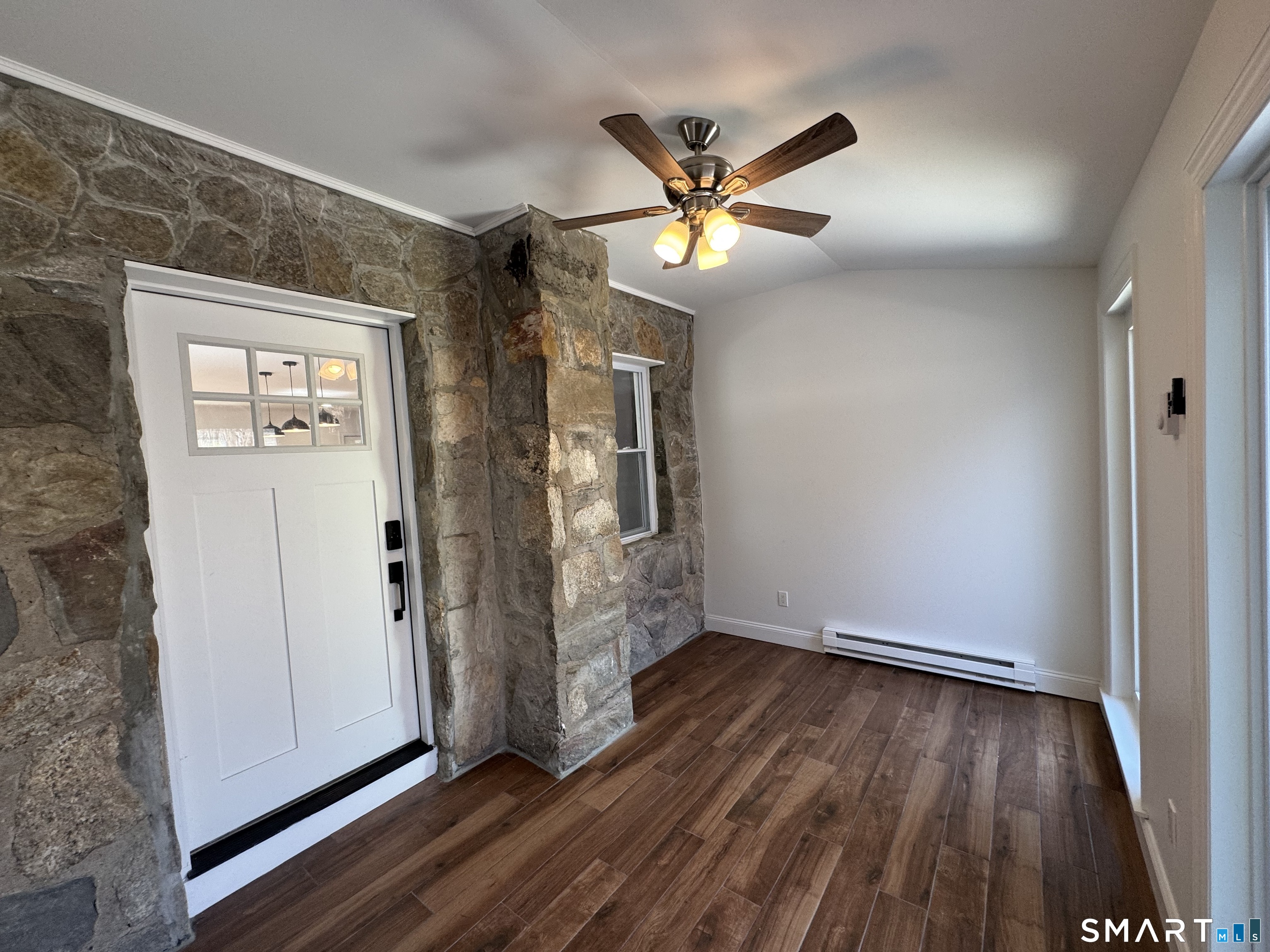 243 Long Hill Road Andover, CT 06232 - Photo 26 of 31 a view of empty room with wooden floor and fan
