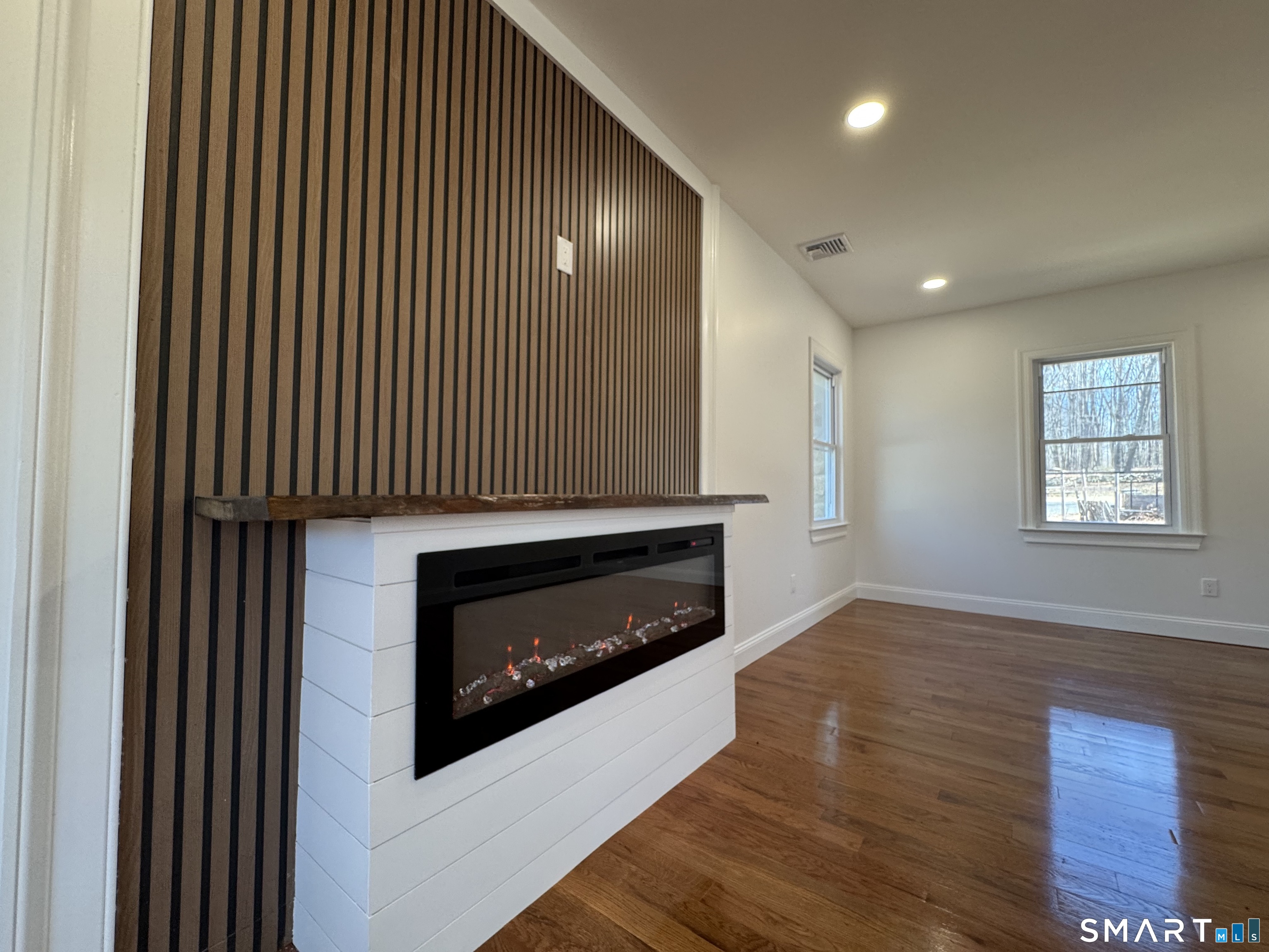 243 Long Hill Road Andover, CT 06232 - Photo 5 of 31 a living room with furniture and a fireplace