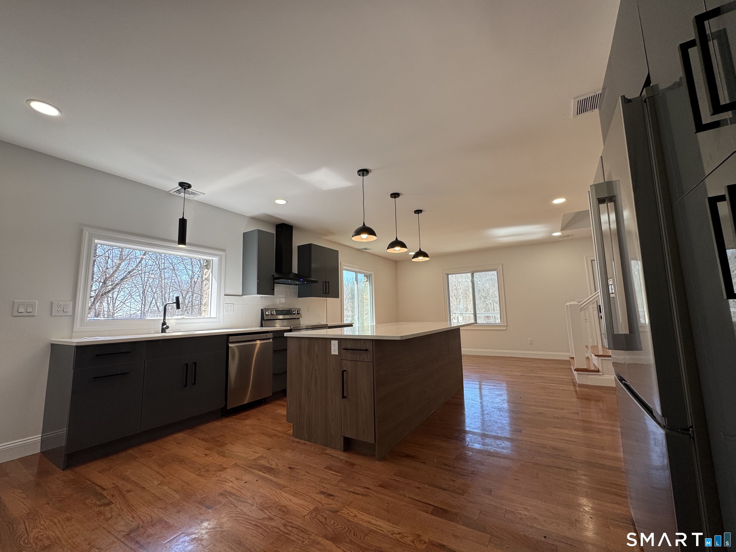 243 Long Hill Road Andover, CT 06232 - Photo 6 of 31 a large kitchen with stainless steel appliances a large counter top