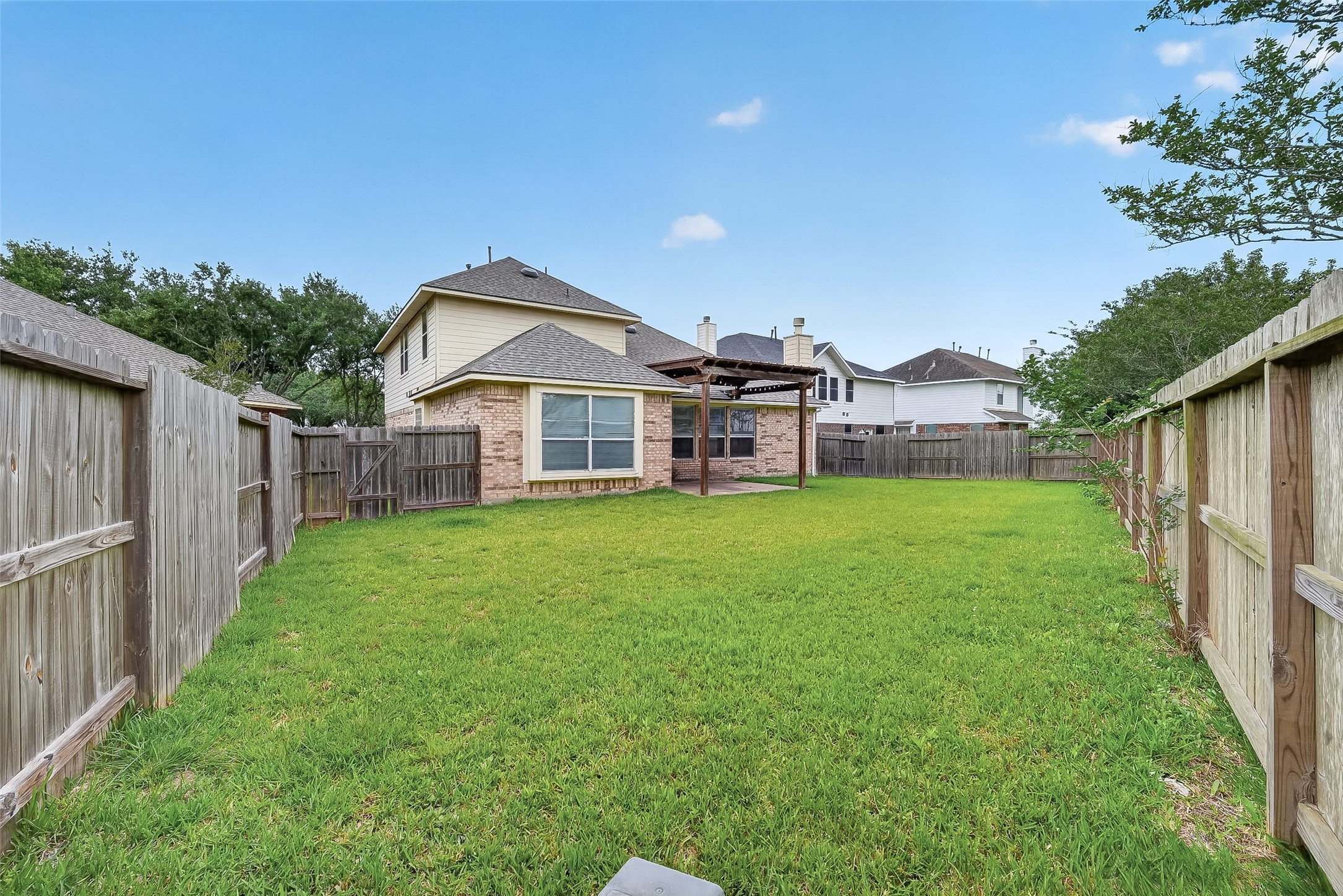 14308 Rocky Briar Lane Rosharon, TX 77583 - Photo 45 of 46 a front view of a house with a yard and porch