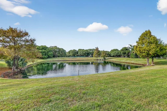 a view of a lake with a house in the background