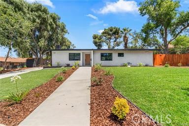151 Barret Road Riverside, CA 92507 - Photo 1 of 1 a front view of house with yard and green space