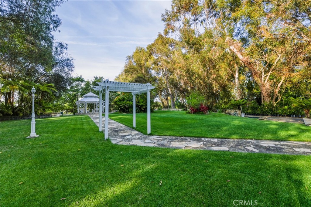 16 Johns Canyon Road Rolling Hills, CA 90274 - Photo 11 of 17 a view of a house with a backyard