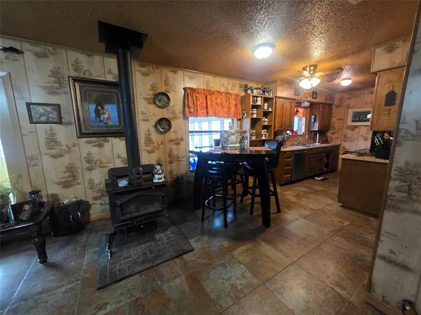 a living room with lots of furniture and gym equipment