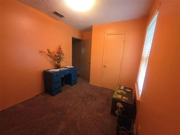 a room with furniture and a window