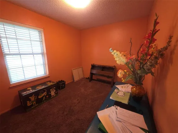 a room with furniture and a flat screen tv