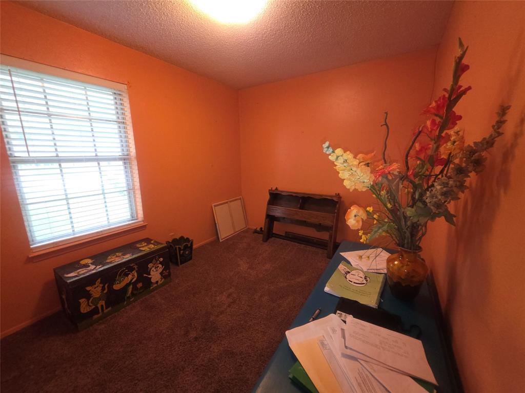 506 Hall Street Graham, TX 76450 - Photo 26 of 28 a room with furniture and a window