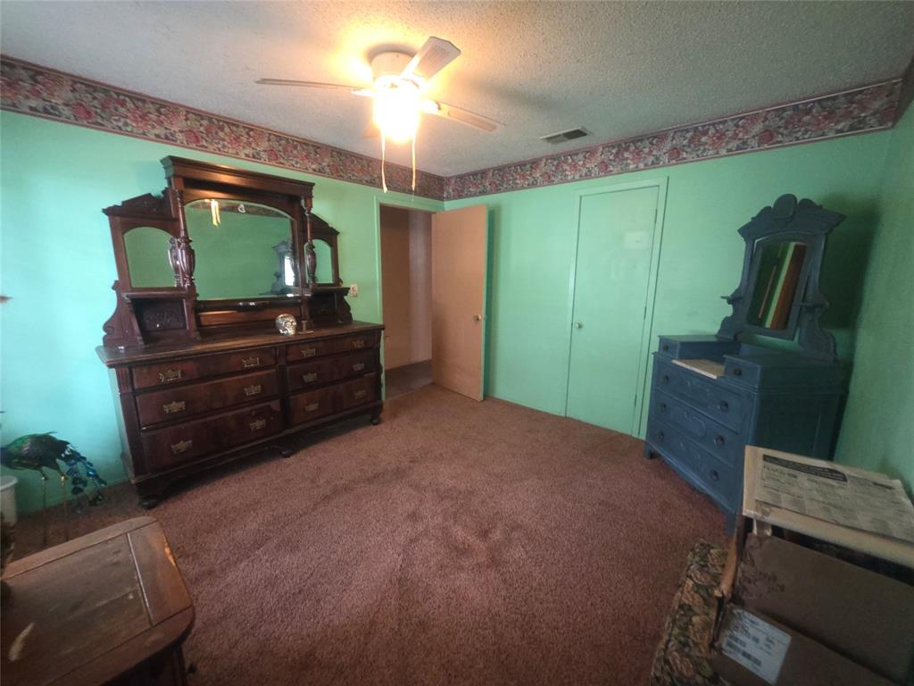 506 Hall Street Graham, TX 76450 - Photo 28 of 28 a bedroom with a bed and a television