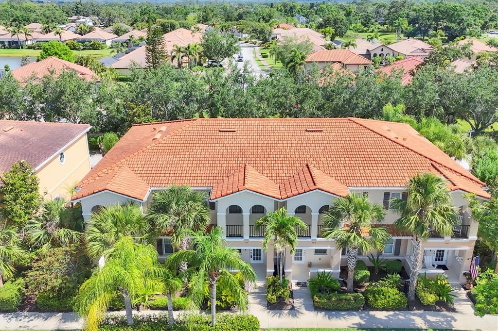 an aerial view of multiple houses and a yard