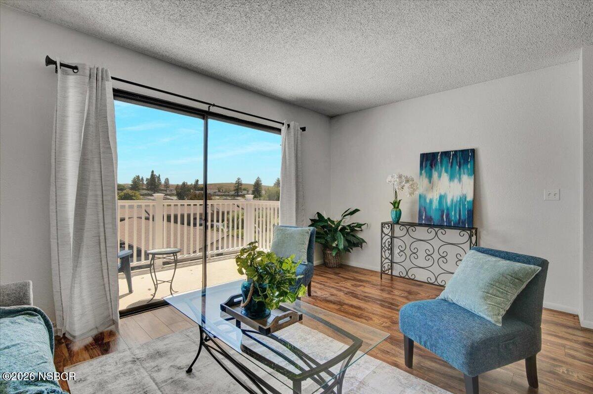 3400 Santa Maria Way, Unit 207B Santa Maria, CA 93455 - Photo 13 of 50 a living room with furniture and a potted plant
