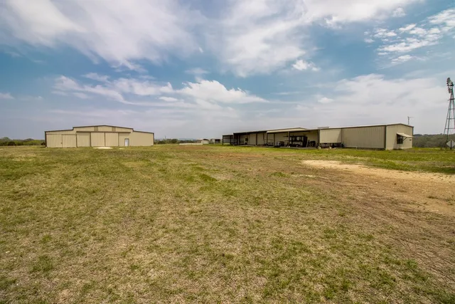 a view of a livingroom with wooden floor and a window