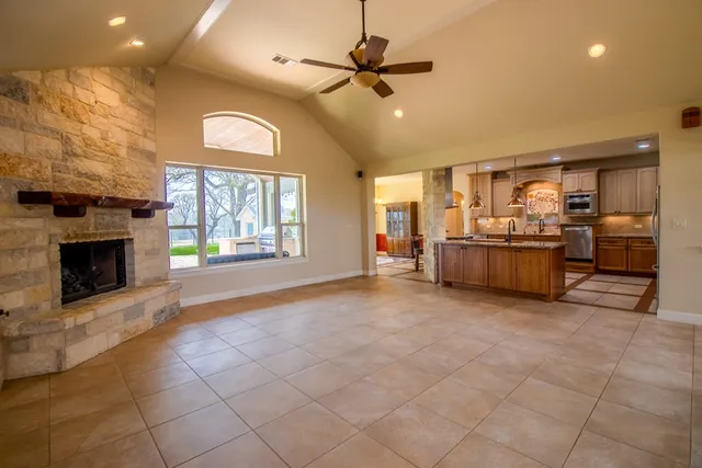 a large kitchen with cabinets and a stove