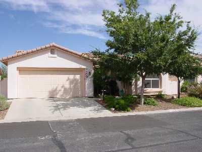 3390 West Desert Bend Loop Tucson, AZ 85742 - Photo 1 of 4 a front view of a house with a yard