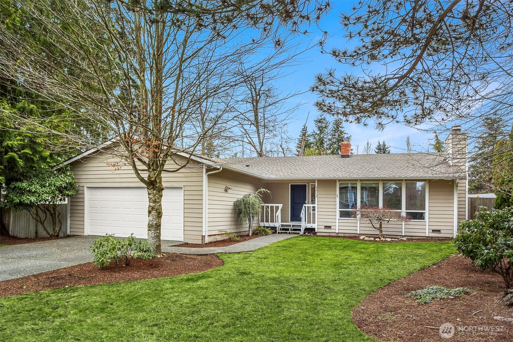 2413 166th Place Southeast Bothell, WA 98012 - Photo 1 of 32 a front view of house with yard and outdoor seating