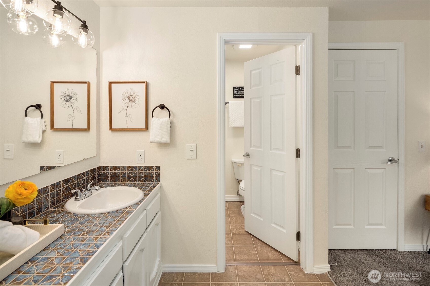 2413 166th Place Southeast Bothell, WA 98012 - Photo 21 of 32 a bathroom with a granite countertop sink and a mirror