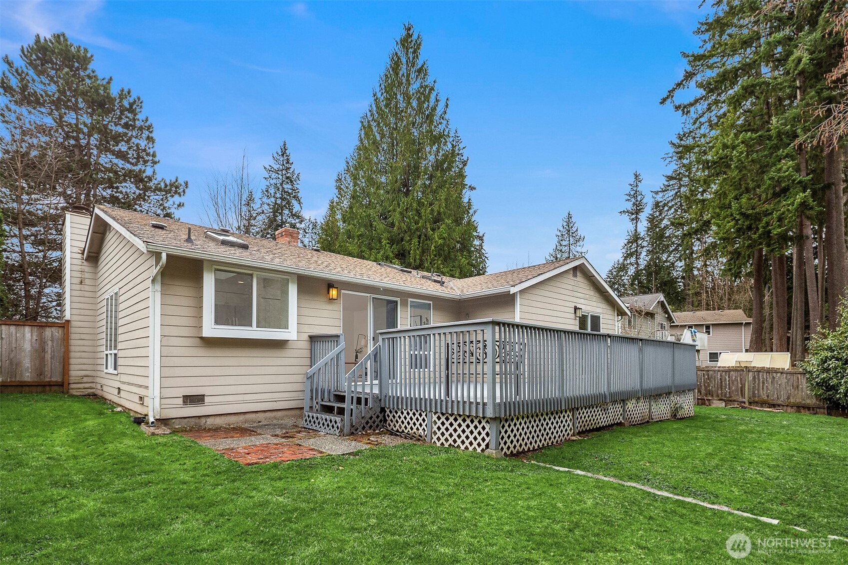 2413 166th Place Southeast Bothell, WA 98012 - Photo 30 of 32 a view of a house with a yard and deck