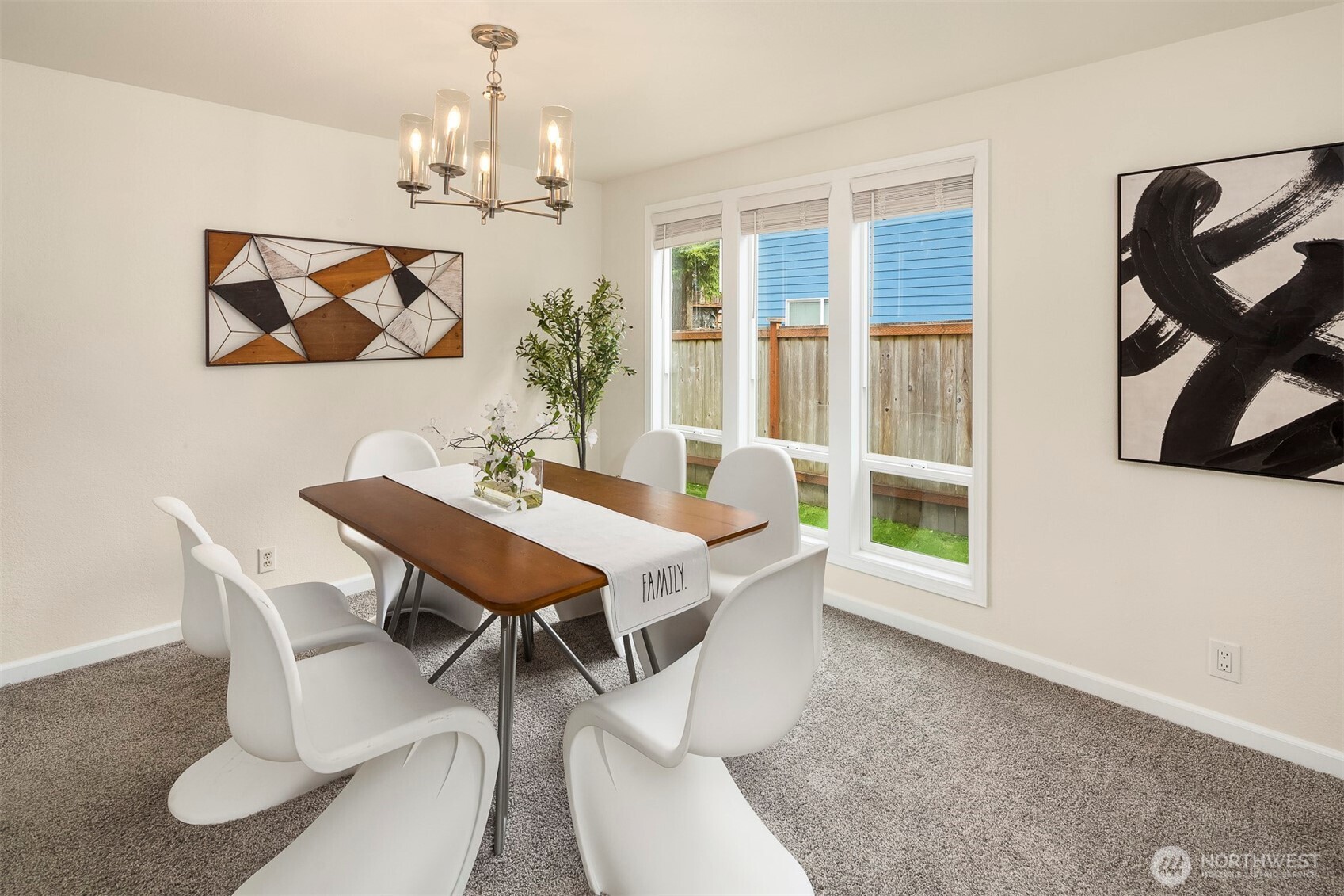 2413 166th Place Southeast Bothell, WA 98012 - Photo 7 of 32 a dining room with furniture a chandelier and window