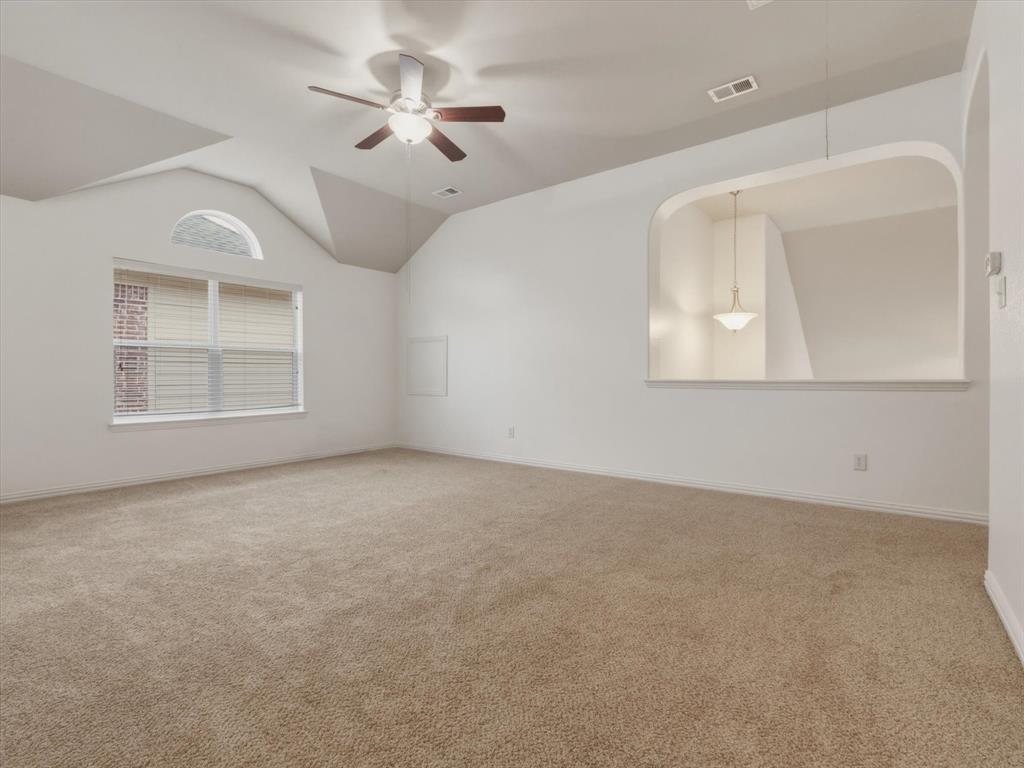 2364 Ranchview Drive Little Elm, TX 75068 - Photo 24 of 33 Expansive game room featuring neutral carpet flooring, a ceiling fan with light fixture