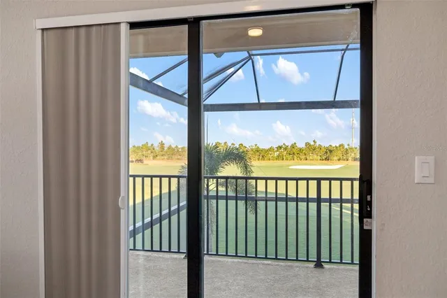 an aerial view of a house with a garden and lake view