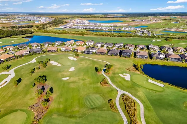 a living room with furniture a fireplace and windows