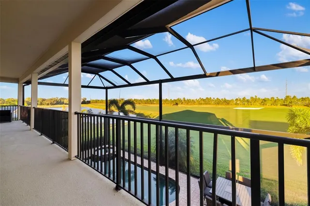 a swimming pool with outdoor seating