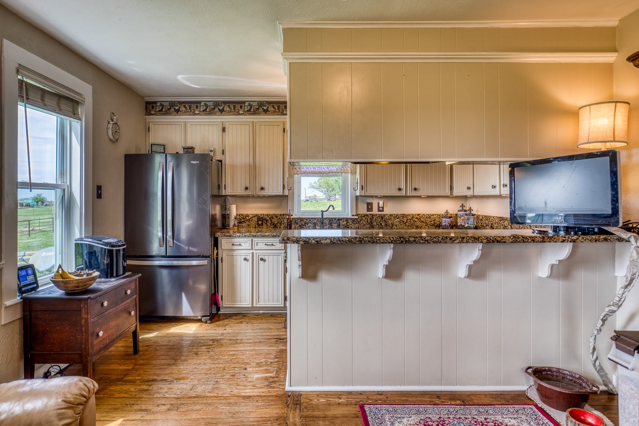 20751 Fm 1155 Street East Washington, TX 77880 - Photo 15 of 49 a kitchen with stainless steel appliances granite countertop a refrigerator a stove and a sink