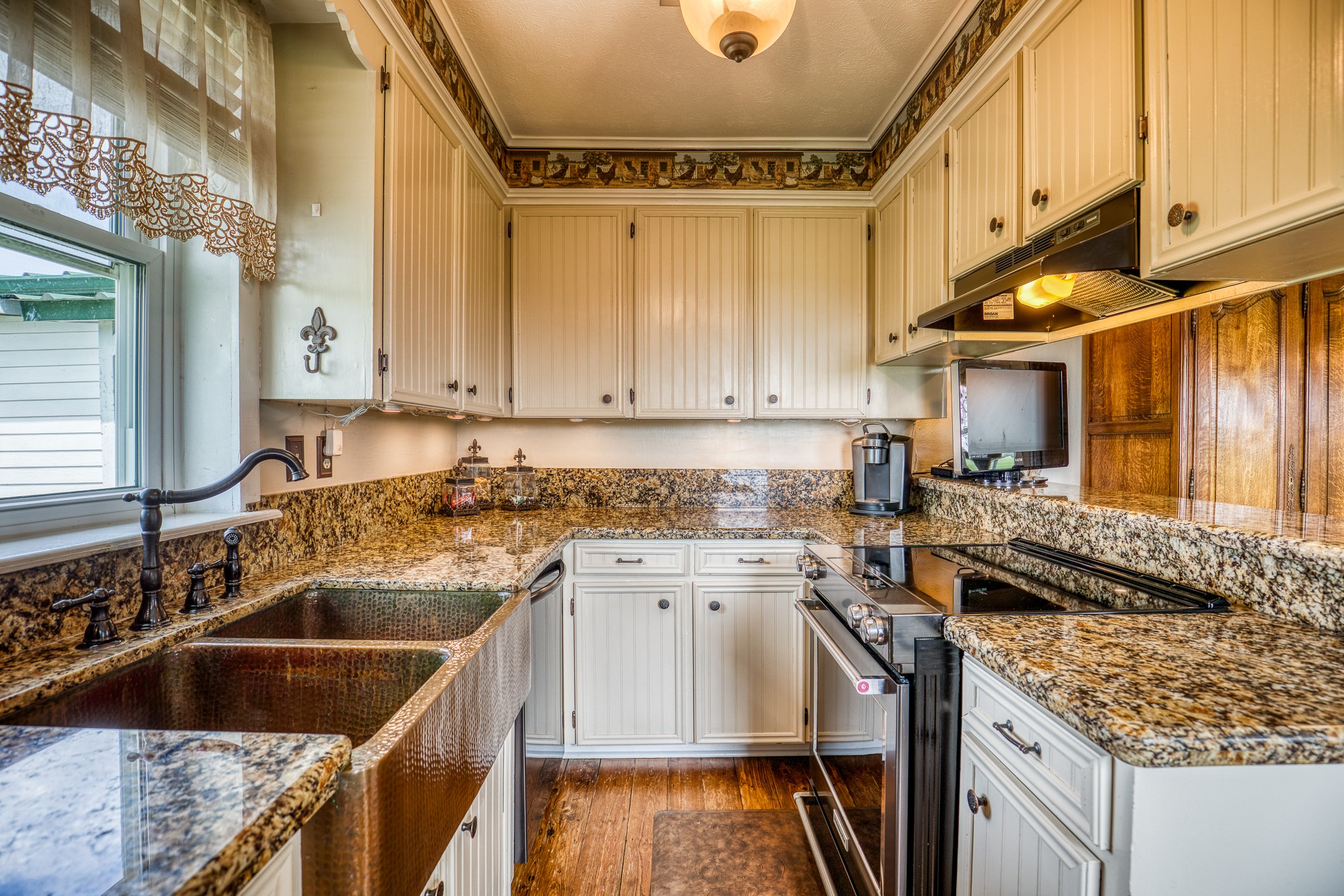 20751 Fm 1155 Street East Washington, TX 77880 - Photo 16 of 49 a kitchen with a sink stove and cabinets