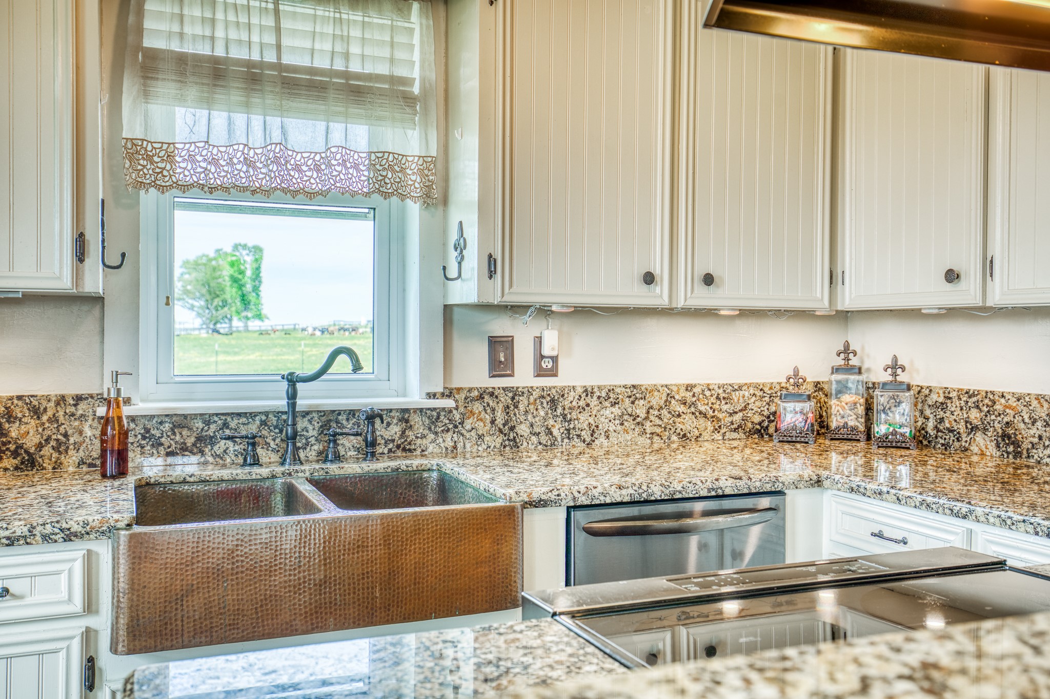 20751 Fm 1155 Street East Washington, TX 77880 - Photo 17 of 49 a kitchen with stainless steel appliances granite countertop a sink stove and cabinets