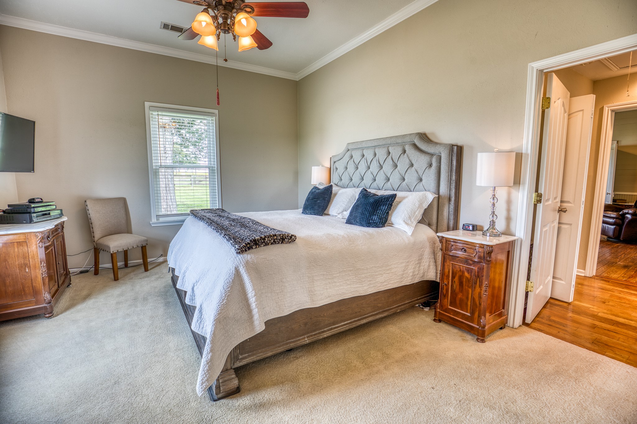 20751 Fm 1155 Street East Washington, TX 77880 - Photo 18 of 49 a bedroom with a bed and a chandelier